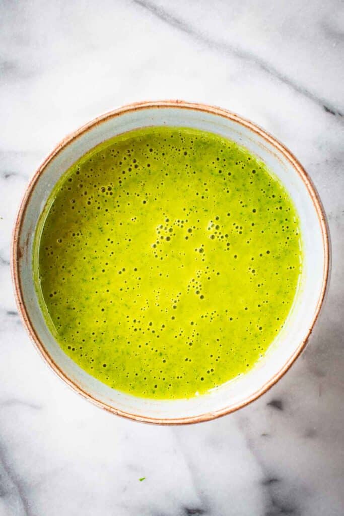 A bowl of freshly made Sicilian lemon garlic herb sauce.