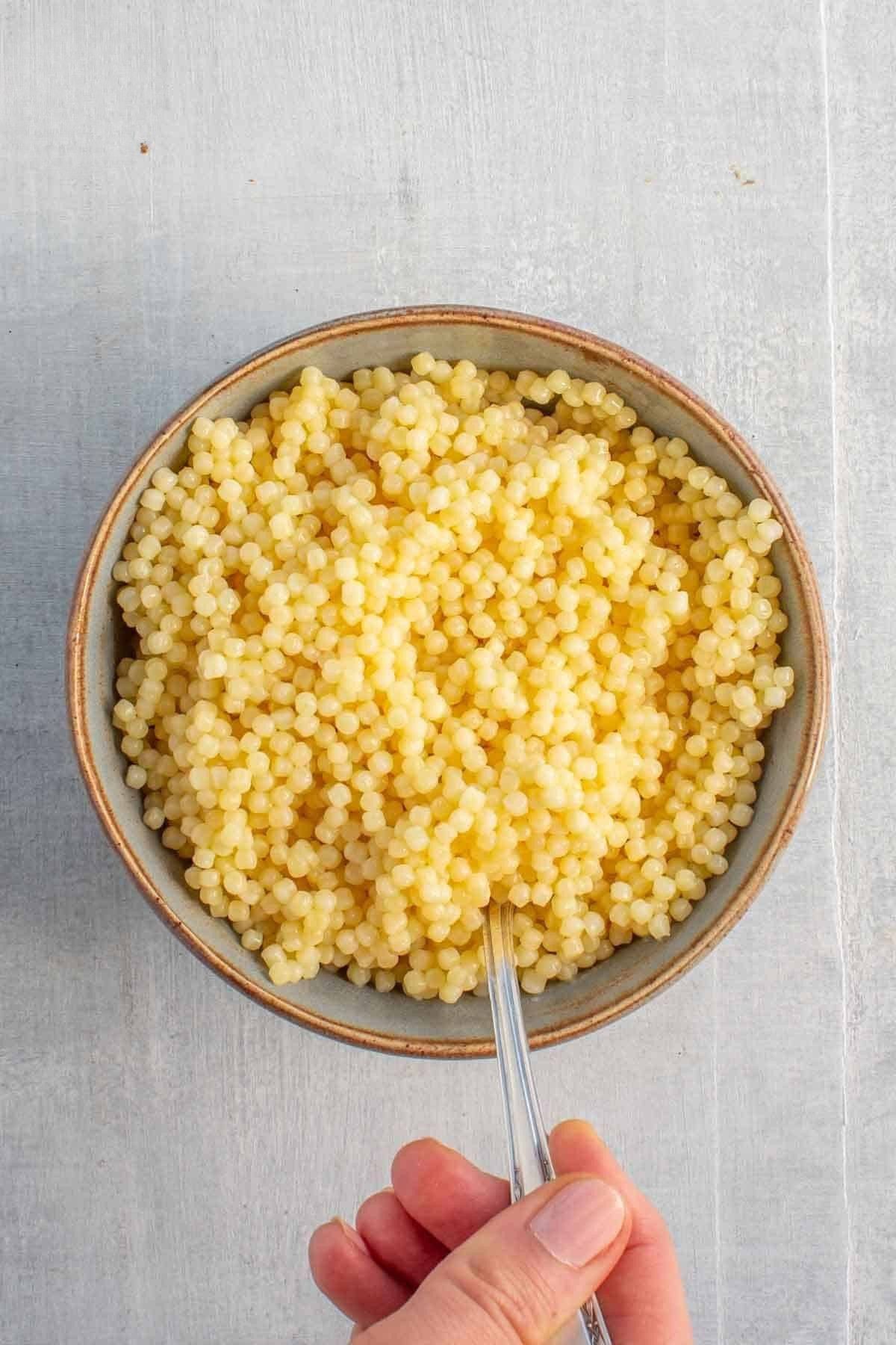 Cooked pasta in a bowl for Italian wedding soup.