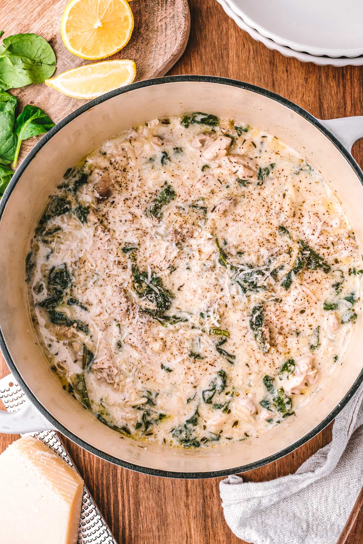 Finished chicken Florentine soup in a Dutch oven, creamy with spinach and orzo.