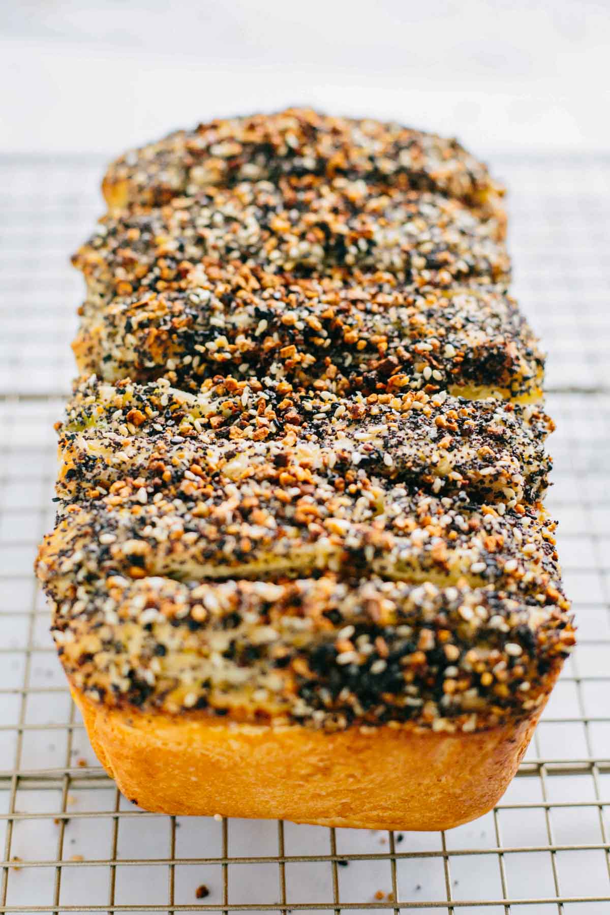 Side view of golden pull apart bread showing crisp edges and textured topping.