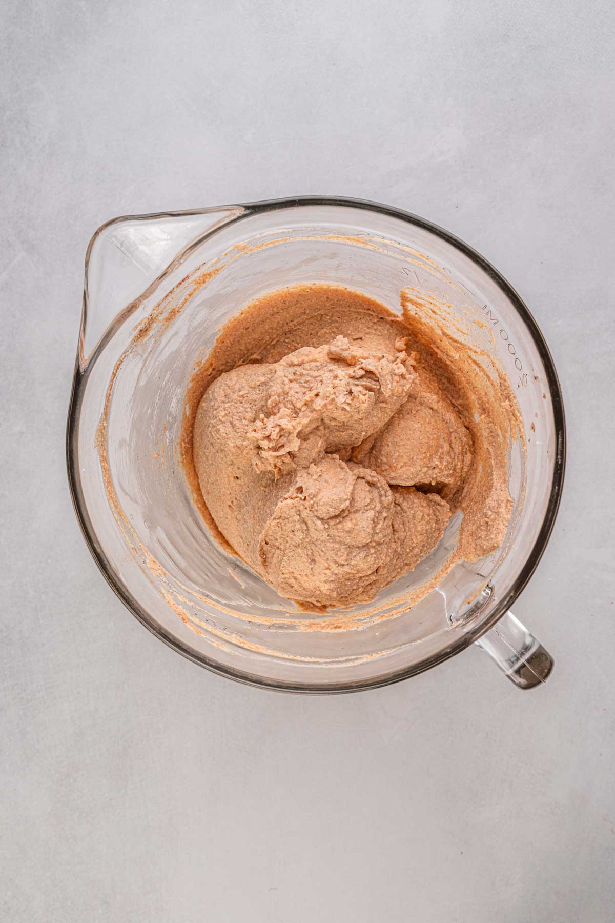 Close-up of spiced pumpkin ricotta mixture blended until thick and creamy, ready to chill before piping.