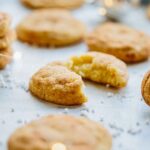 Close-up of chai snickerdoodles with blurred lights in the background, highlighting the chewy interior.