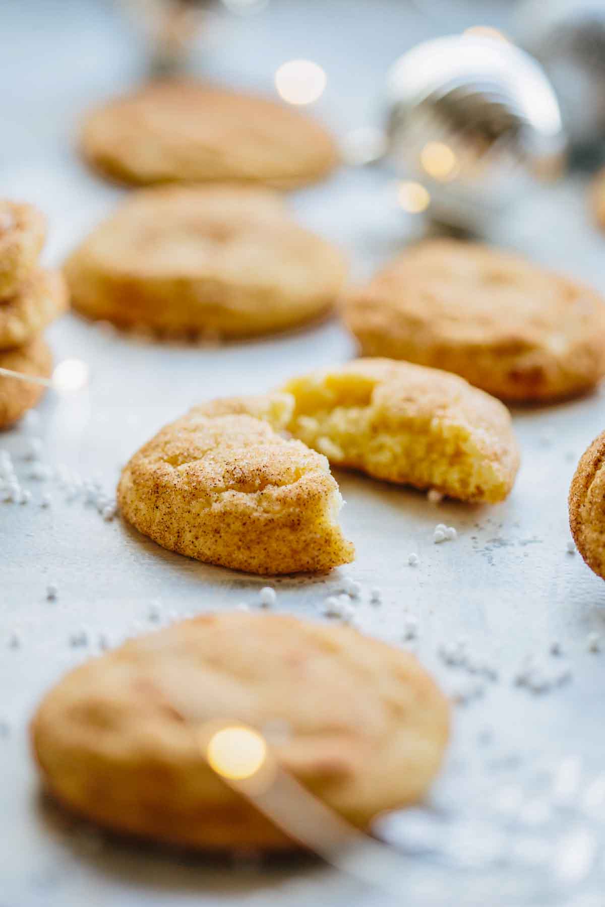 Close-up of chai snickerdoodles with blurred lights in the background, highlighting the chewy interior.
