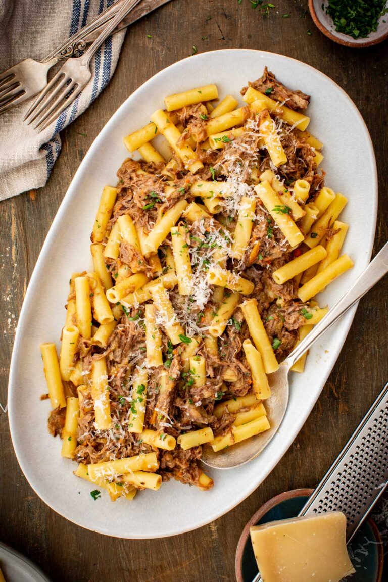 Platter of pasta alla Genovese with tender shredded beef, sweet onion sauce and freshly grated cheese.