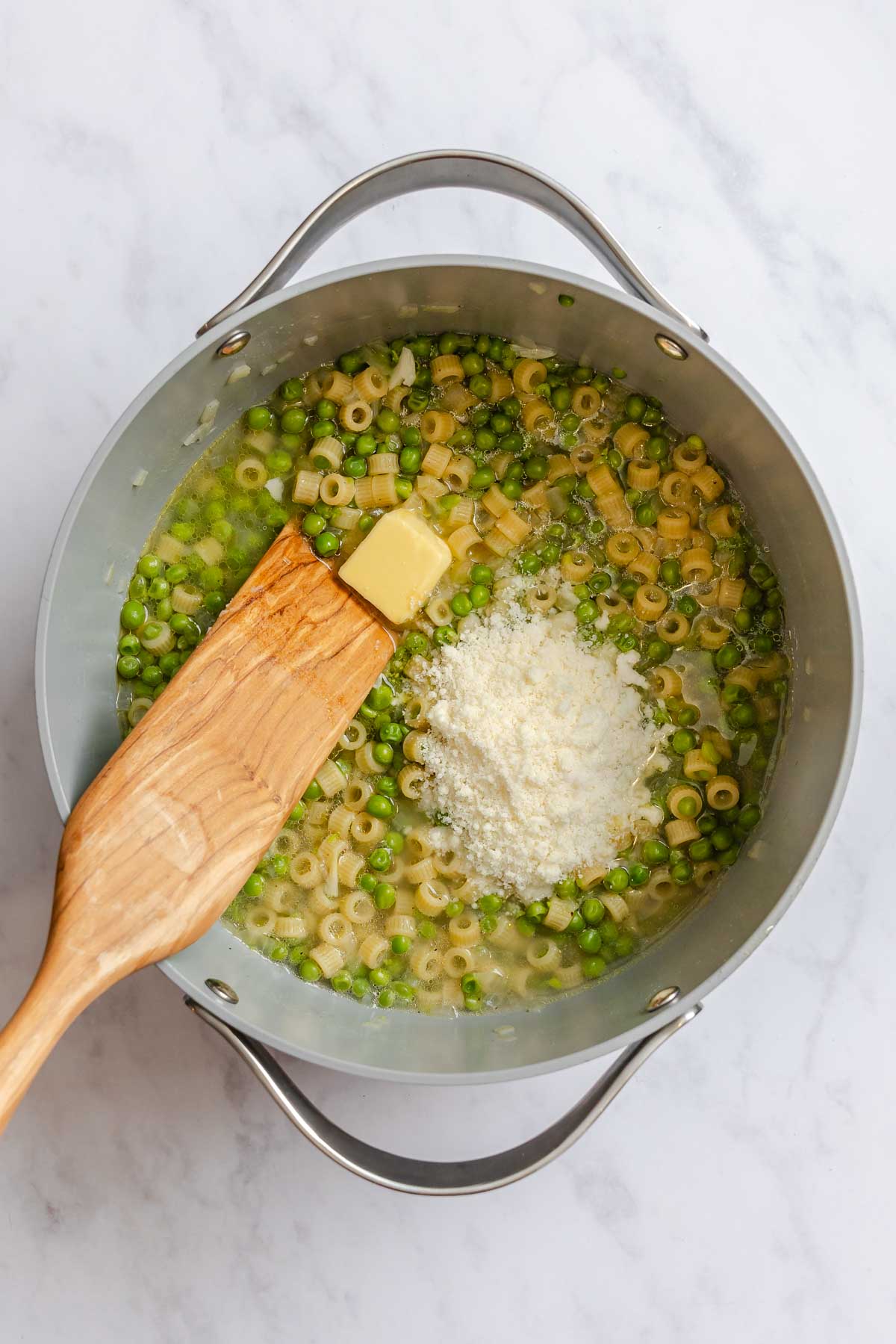 Pasta e piselli ready to be emulisified with butter and Pecorino Romano.