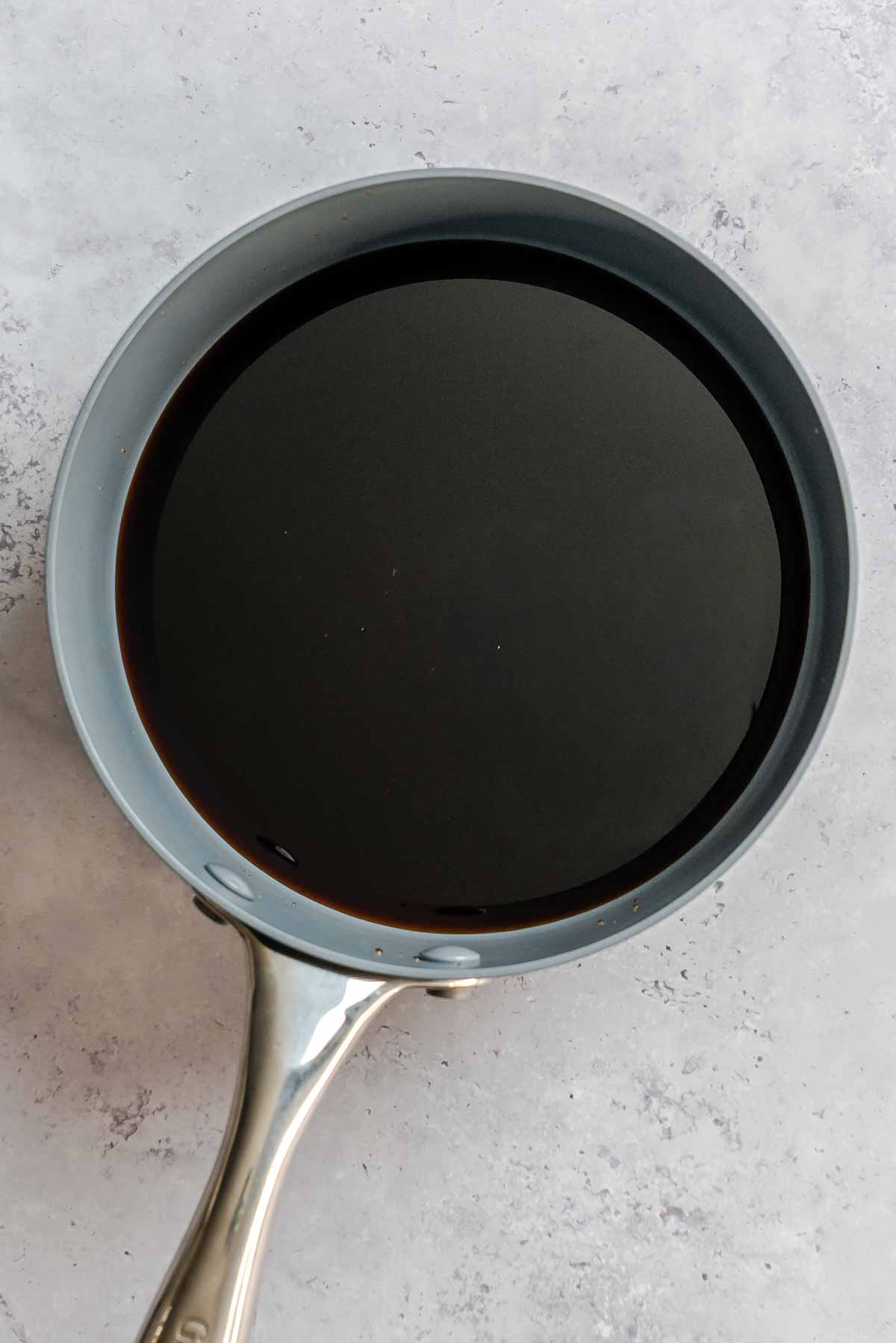 Balsamic vinegar on a large sauce pan.