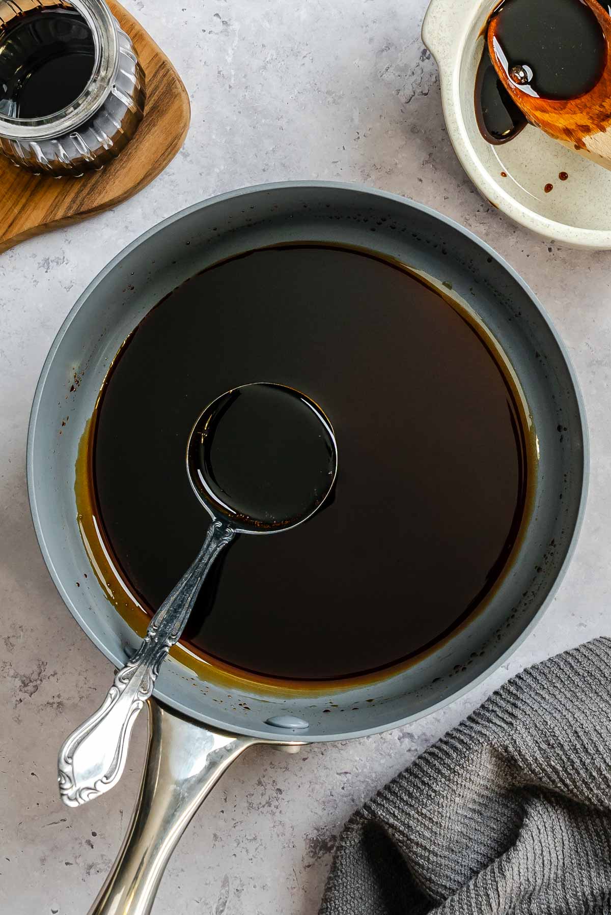 Balsamic vinegar reduced down to a thick, syrupy consistency on a sauce pan.