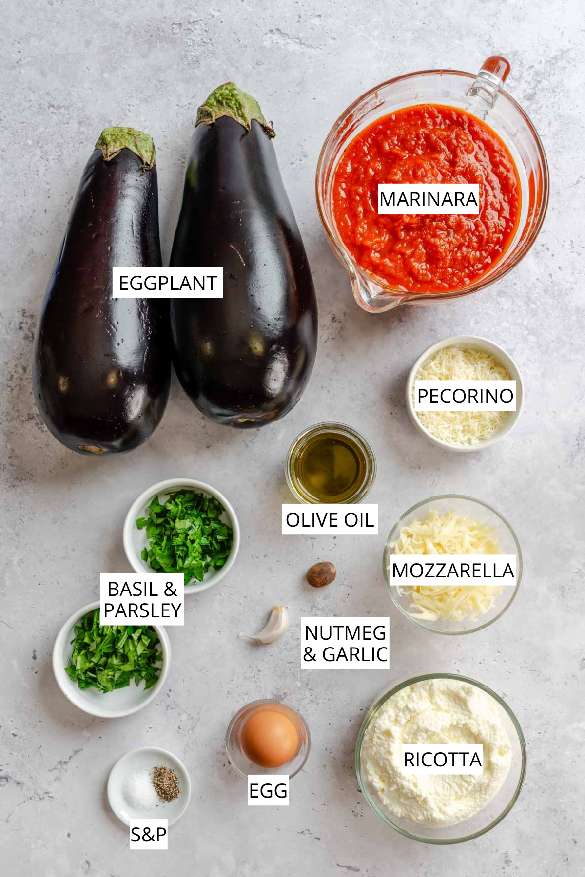 Labeled ingredients for eggplant rollatini: eggplant, marinara, pecorino, mozzarella, ricotta, egg, olive oil, basil, parsley, garlic, nutmeg, salt, and pepper.