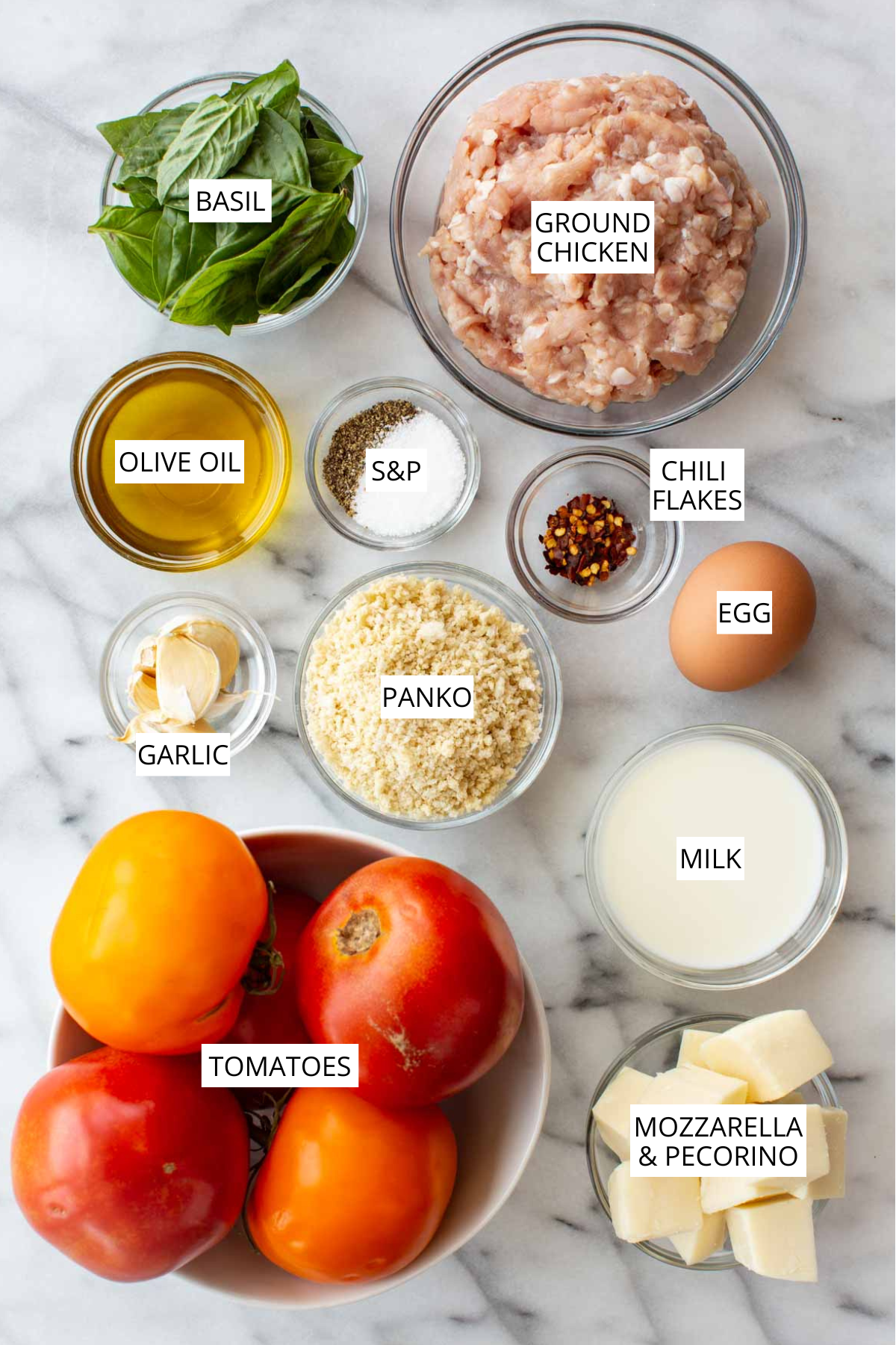 Mozzarella stuffed chicken meatballs labeled ingredients, including ground chicken, basil, olive oil, chili flakes, egg, panko, garlic, tomatoes, milk and mozzarella.