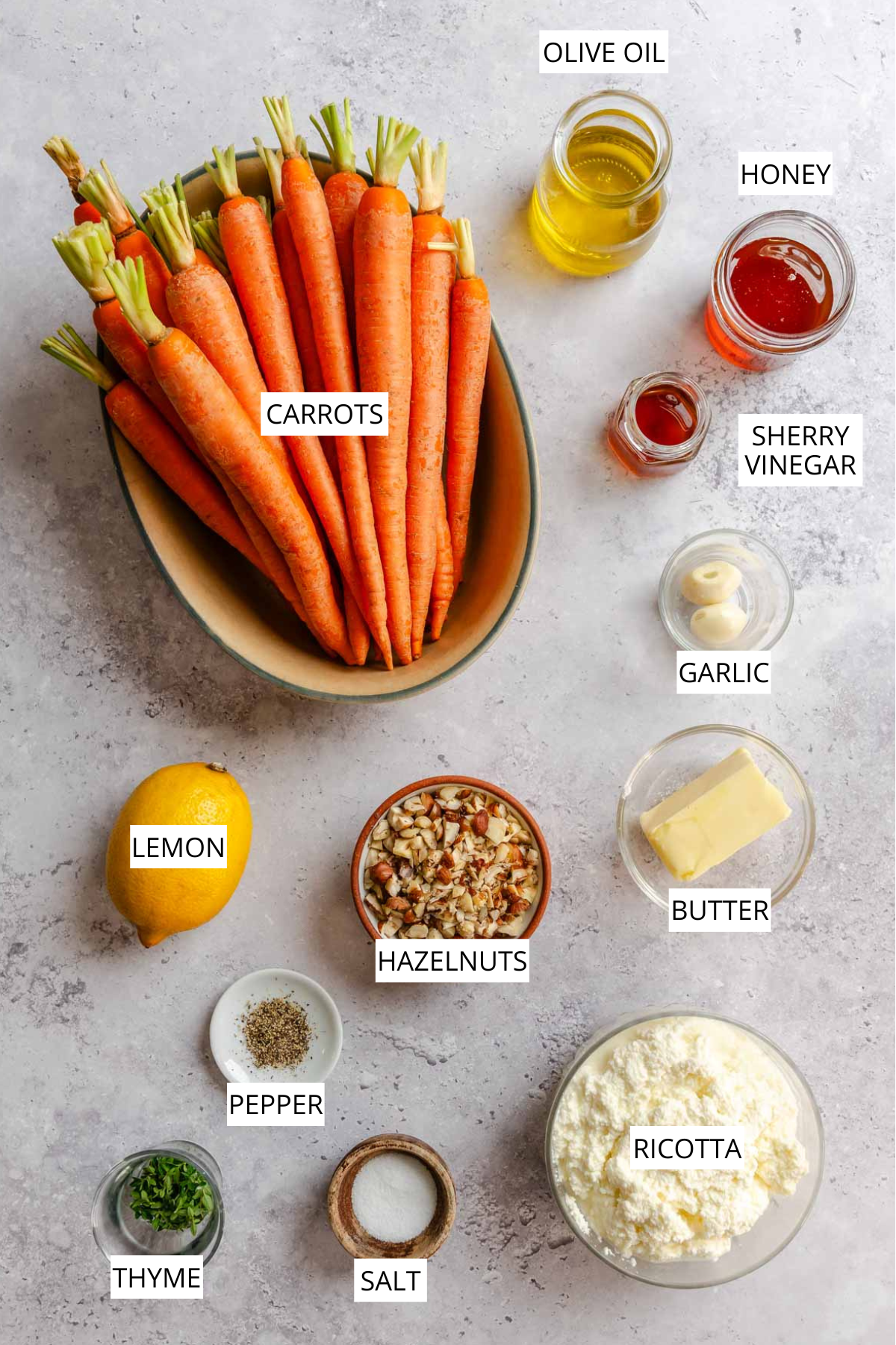 Honey roasted carrots labeled ingredients, including carrots, olive oil, honey, sherry vinegar, lemon, hazelnuts, butter, garlic, thyme, salt and pepper, ricotta.