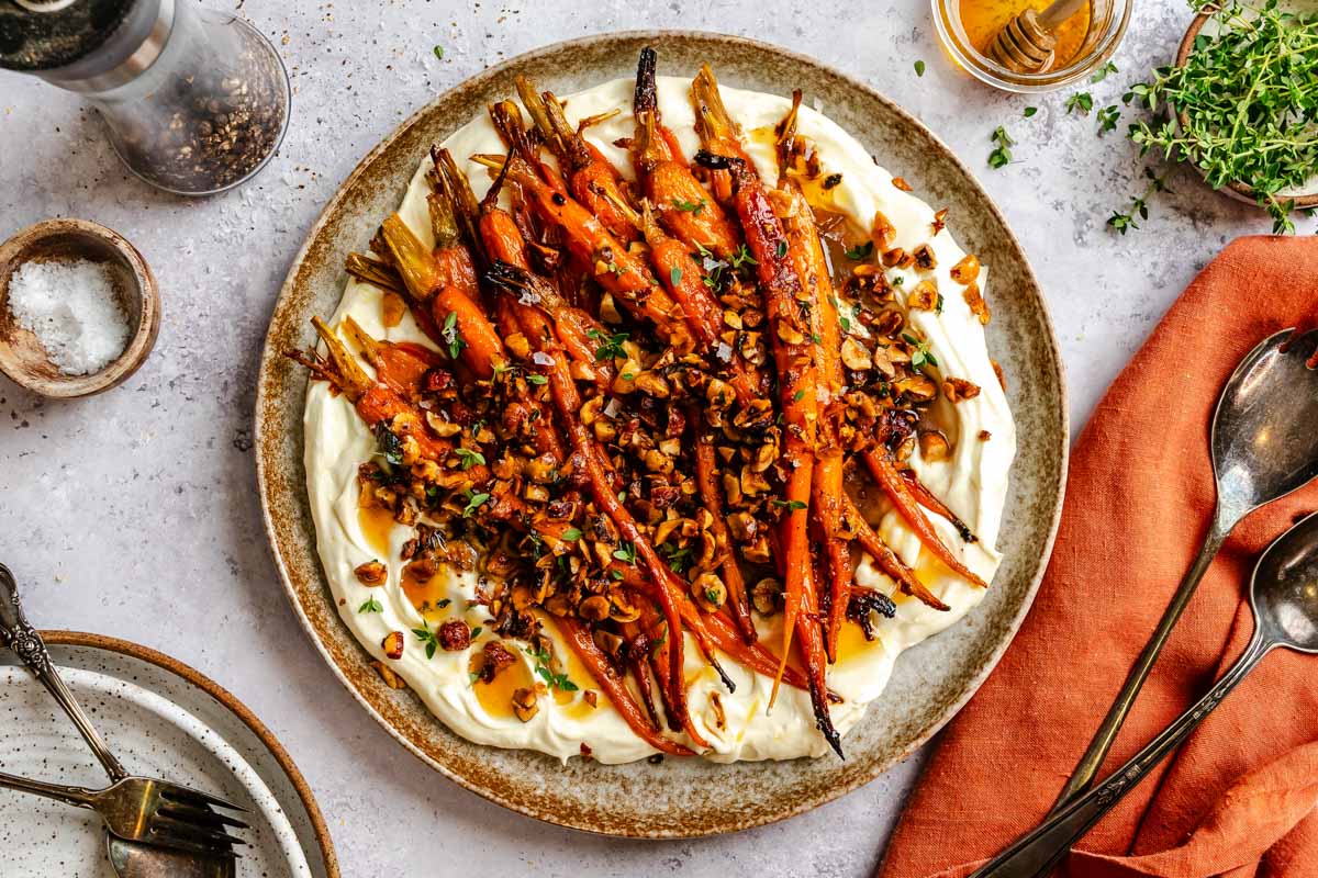 Overhead view of honey roasted carrots with whipped ricotta.